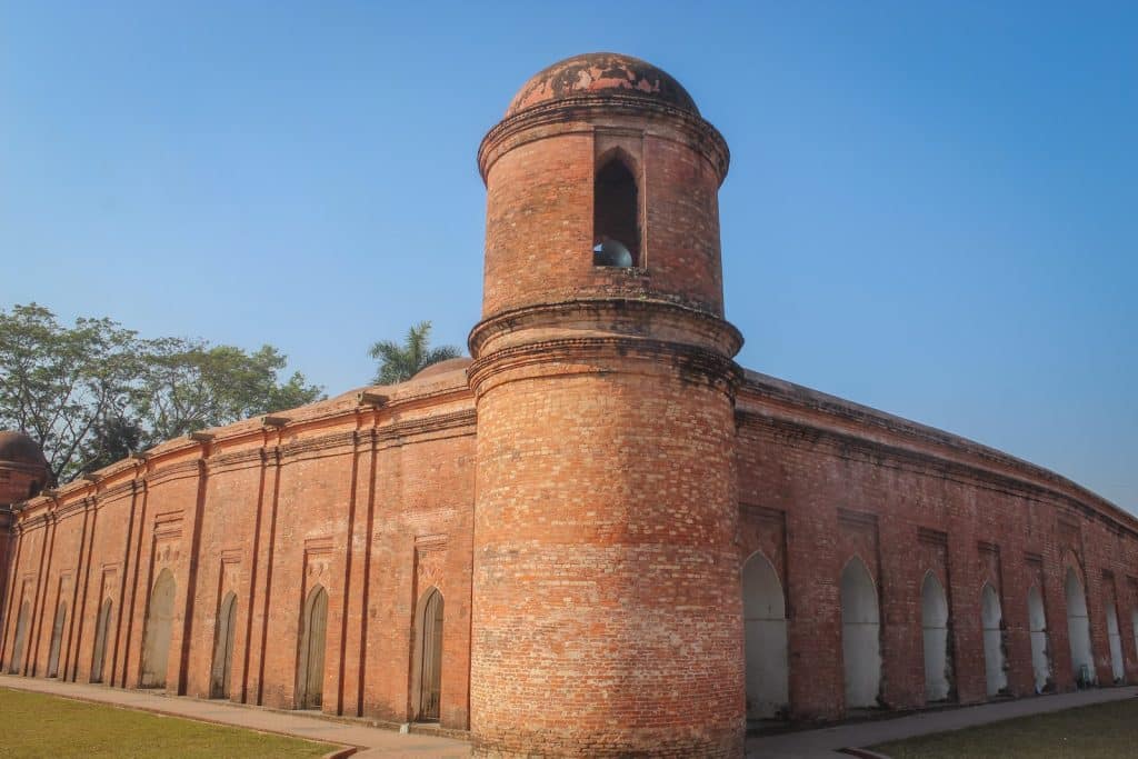 a tall brick building with a clock tower